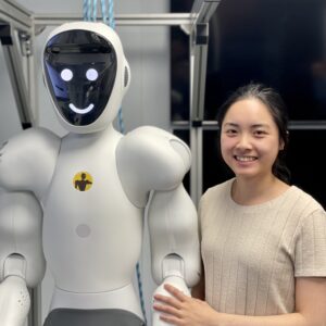 Humanoid EVE firmy 1X (dawniej Halodi Robotics), poprzednik robota NEO, obok inżynierki w laboratorium